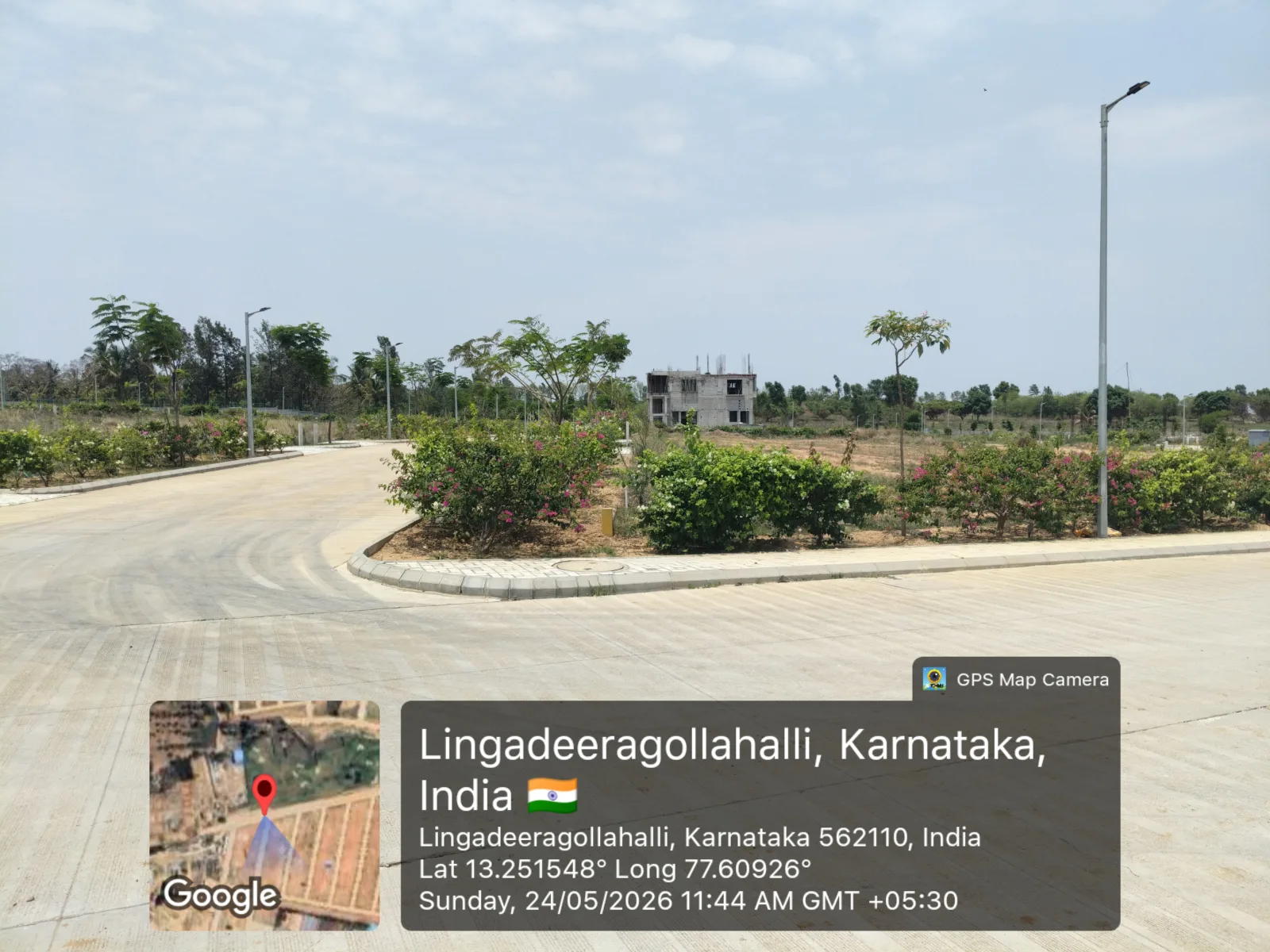 Internal road and landscaped median at Arvind The Park, Devanahalli