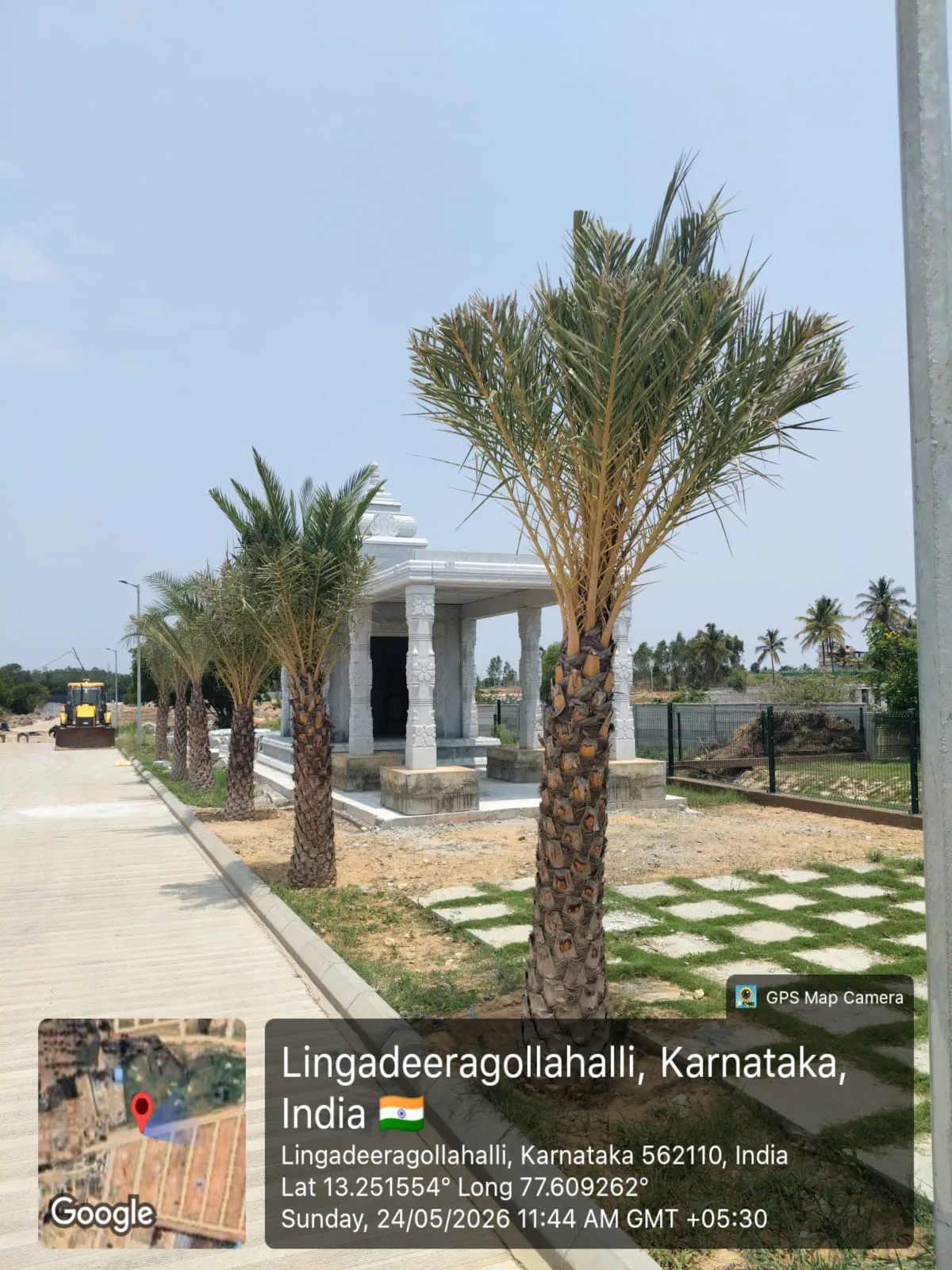 Stone pavilion and avenue trees at Arvind The Park, Devanahalli